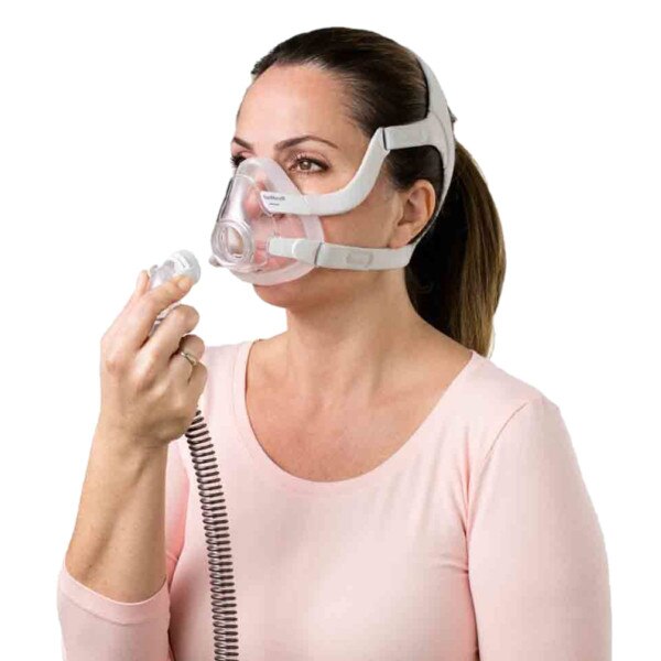 Woman Attaching Tube to F20 Mask
